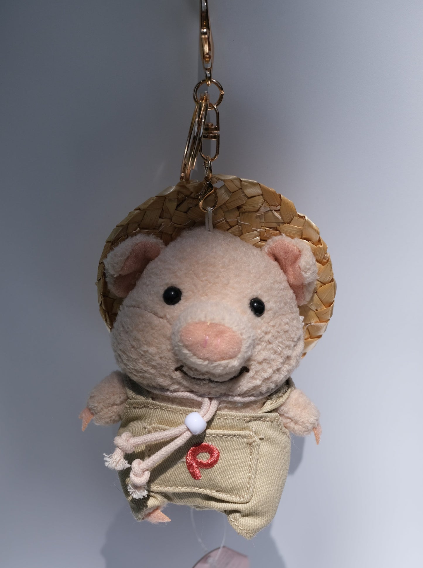 Pig Farmer with Straw Hat Plush Keychain, Front Side