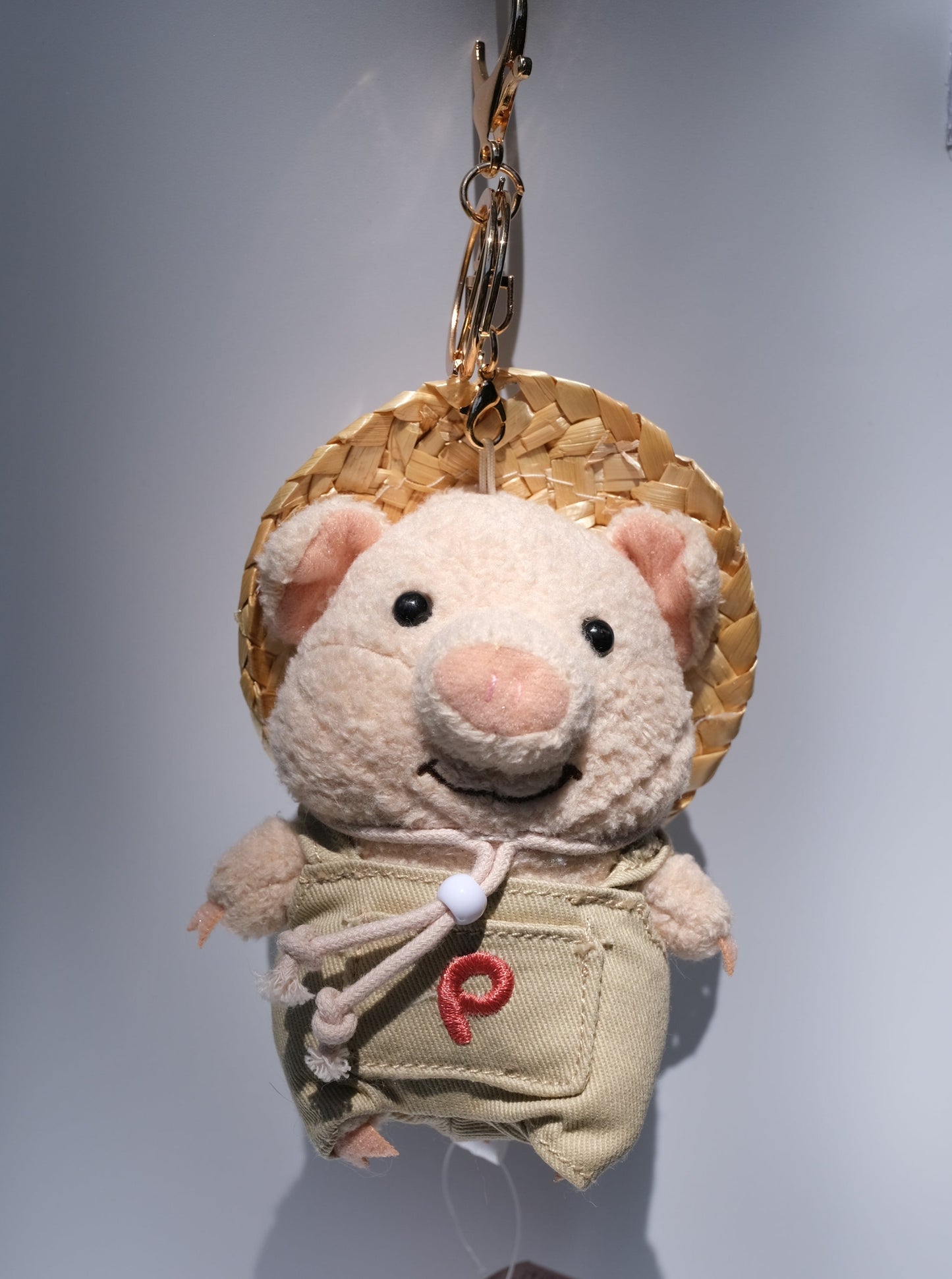 Pig Farmer with Straw Hat Plush Keychain, Detail