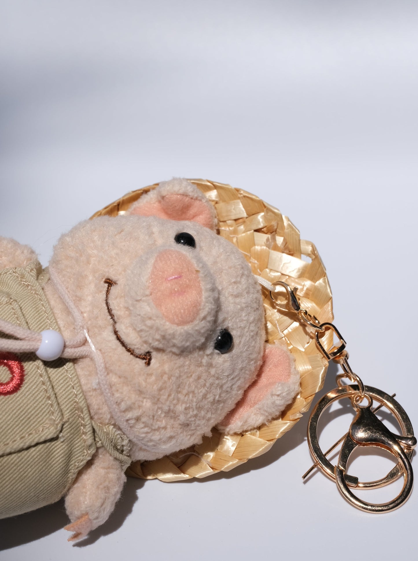 Pig Farmer with Straw Hat Plush Keychain, Detail