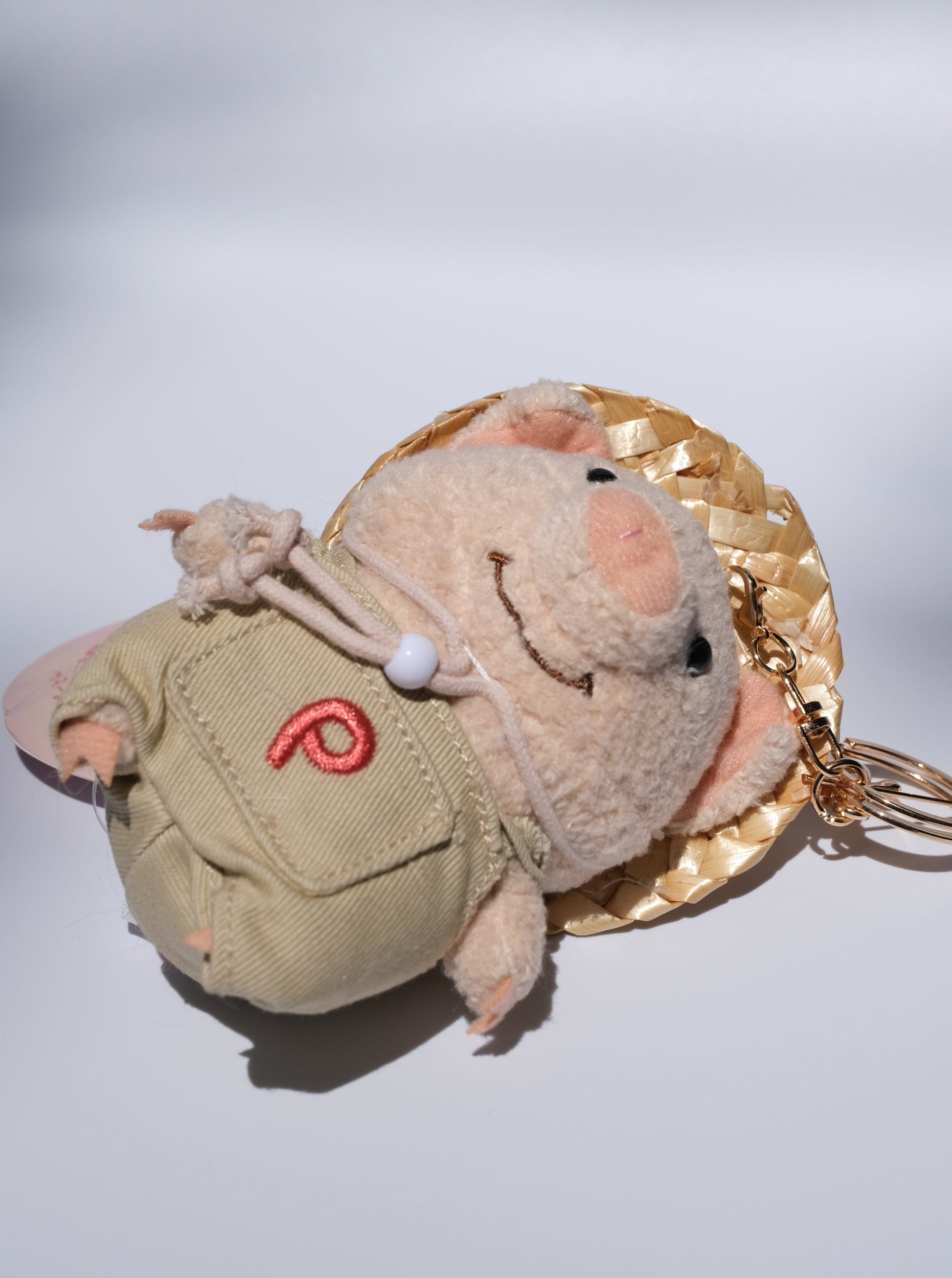 Pig Farmer with Straw Hat Plush Keychain, Detail